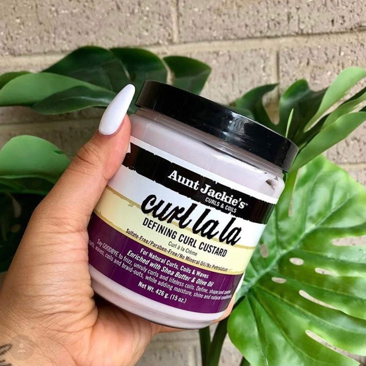 Aunt Jackie's custard applied to natural curls for smooth definition
