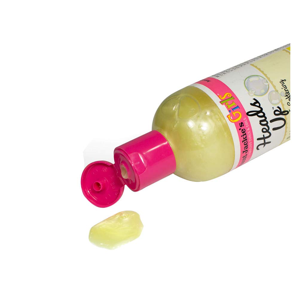 Aunt Jackie's pump dispensing creamy lather to improve detangling and softness