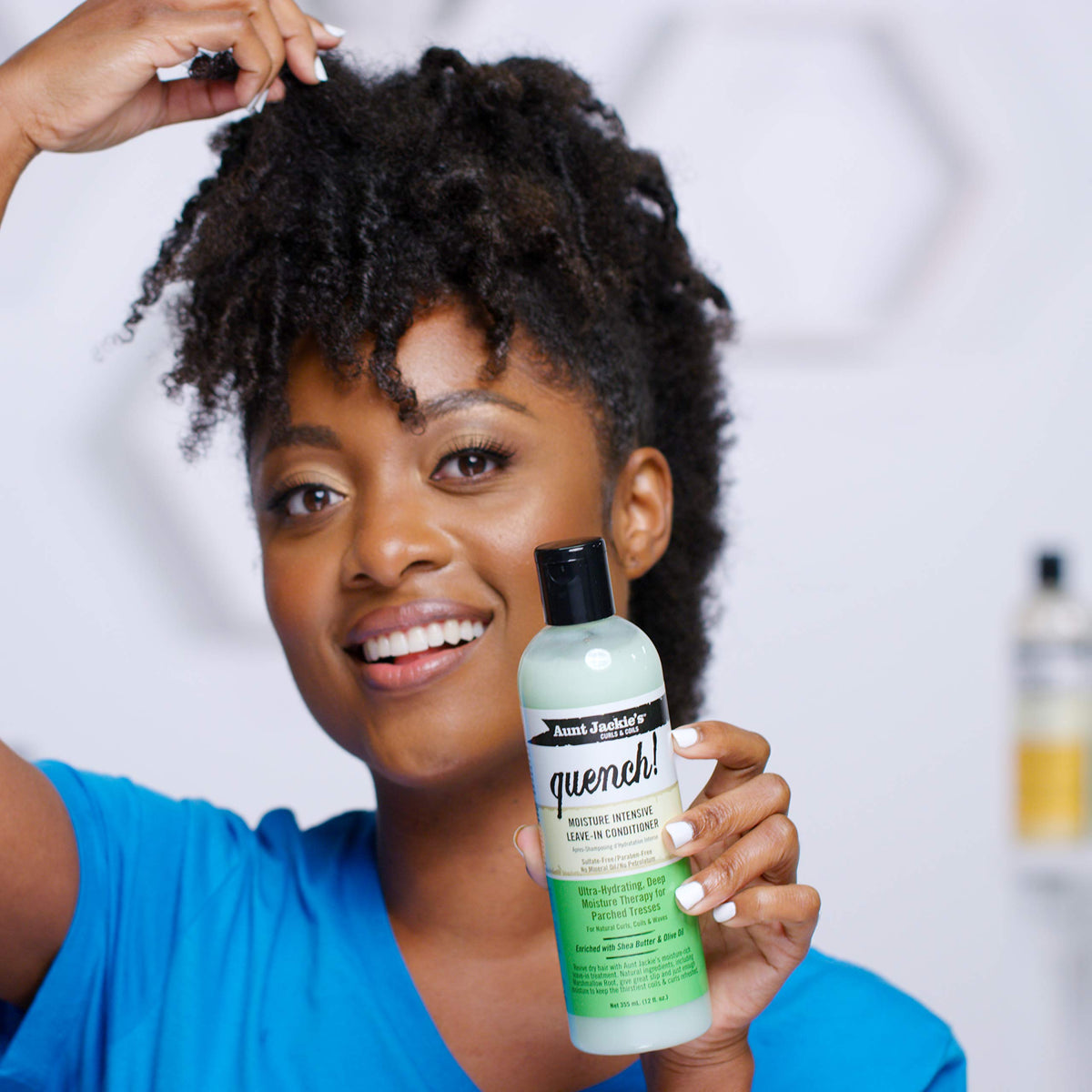 Aunt Jackie's product applied to curly hair for detangling benefit