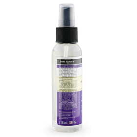 Aunt Jackie's liquid texture on finger illustrating lightweight grapeseed oil sheen benefits