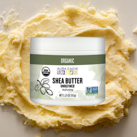 Aura Cacia shea butter on bathroom shelf evoking natural skincare routine