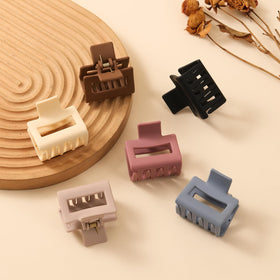 Multicolor Auseibeely clips displayed on table for styling variety