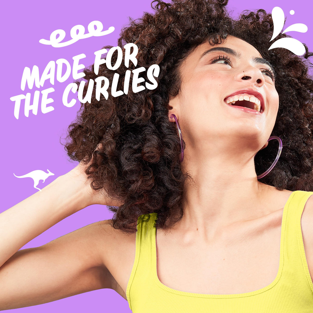 Aussie detangling milk pouring from bottle to ease combing and reduce breakage