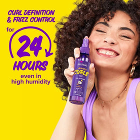 Aussie label showing coconut and jojoba oil ingredients for frizz control
