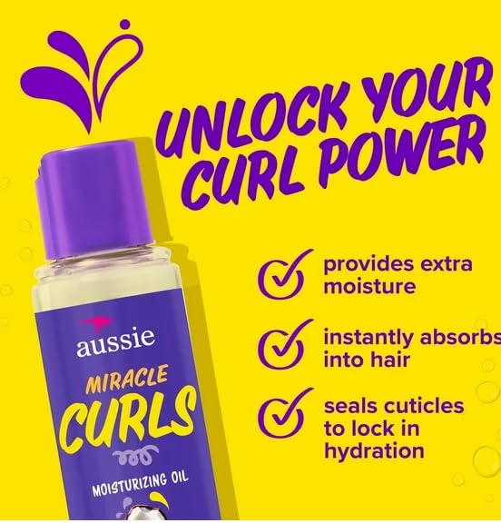 Aussie Miracle Moist applying to damp hair demonstrating frizz control