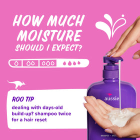Aussie bottle next to hand for scale showing large 30.4 fl oz value benefit