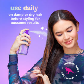 Aussie mist applied to curly hair to detangle and boost definition