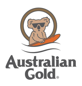 Australian Gold bottle in beach setting suggesting tropical scent and relaxed tanning experience