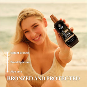 Australian Gold being applied to forearm demonstrating instant bronzer benefit