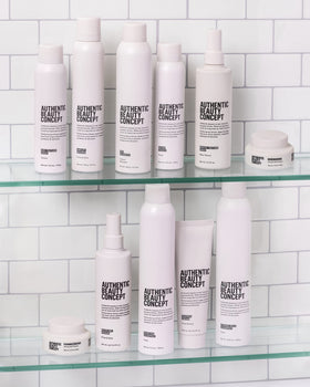 Authentic Beauty Concept mousse being blow-dried to create root lift and body