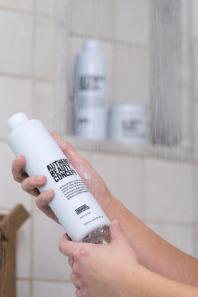 Authentic Beauty Concept shampoo lathering on wet hair to show effective cleansing