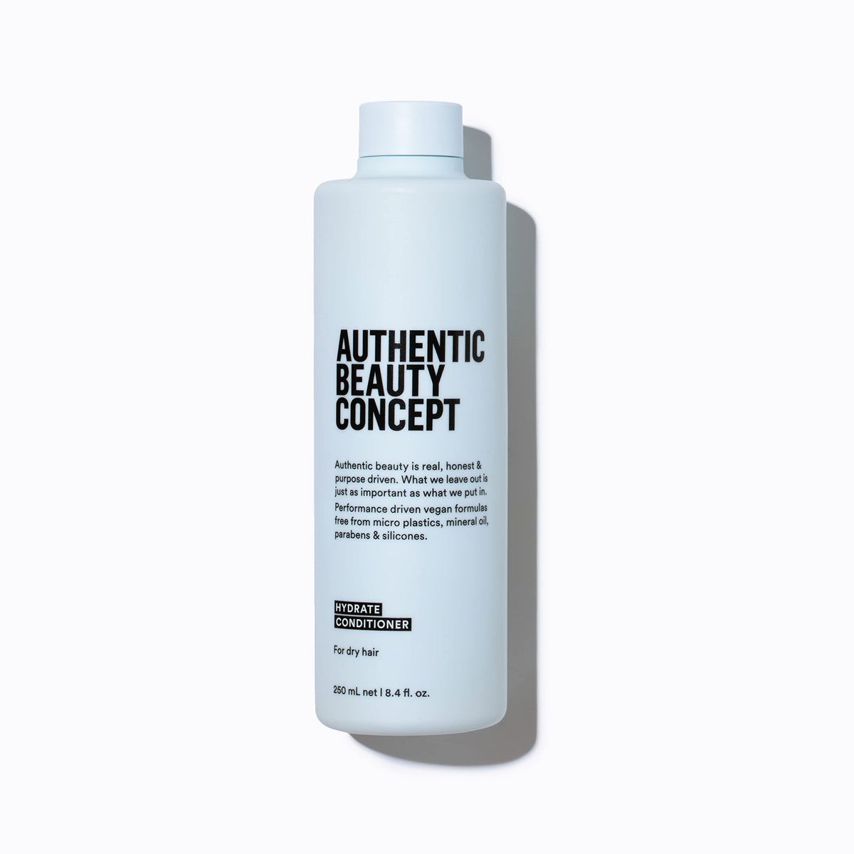 Authentic Beauty Concept front bottle view showing clean design and vegan benefit