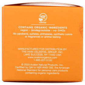 Avalon Organics jar beside coin for scale to show compact 1.7 oz travel-friendly size