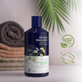 Avalon Organics bottle on a bathroom shelf among plants conveying natural, eco-focused care