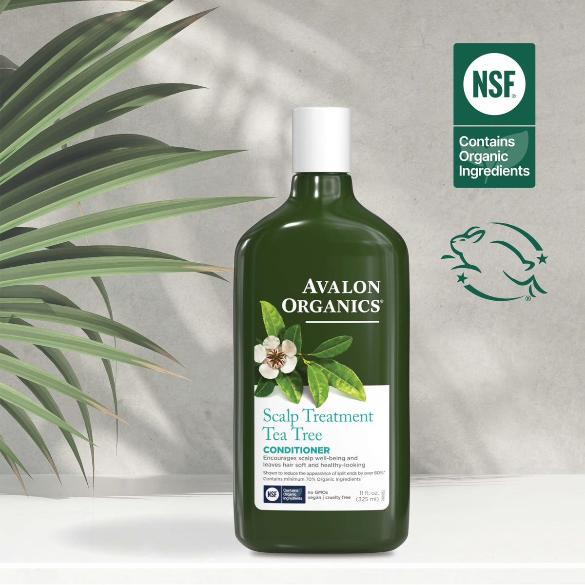Avalon Organics bottle beside tea tree and aloe botanicals for natural care