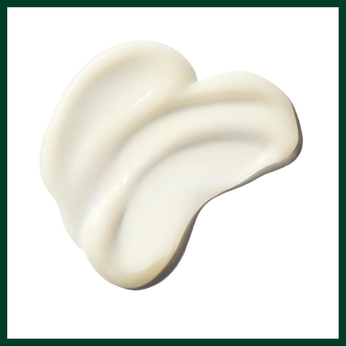 Aveda Be Curly bottle next to hand illustrating 11.8 fl oz scale and portability