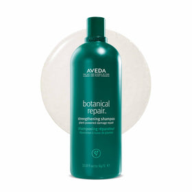 Aveda bottle front view showing brand and repair shampoo benefits