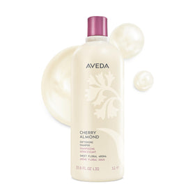 Aveda front packaging showing bottle and brand with clean, soft-hair promise