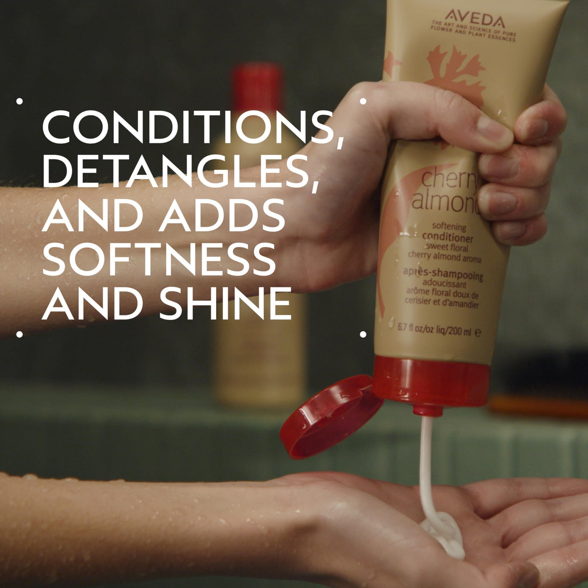 Aveda Cherry Almond pump dispensing conditioner demonstrating convenient use and control