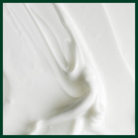 Aveda conditioner on a shower ledge indicating easy daily use