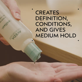 Aveda Confixor pump and label close-up highlighting ingredients and clean-formula benefits