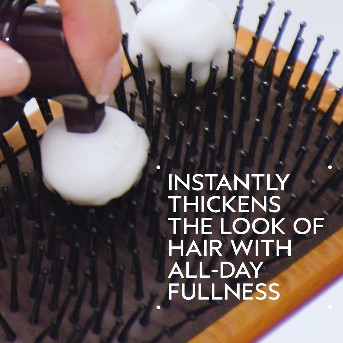 Aveda Invati foam dispensed in hand showing airy mousse texture for instant volume