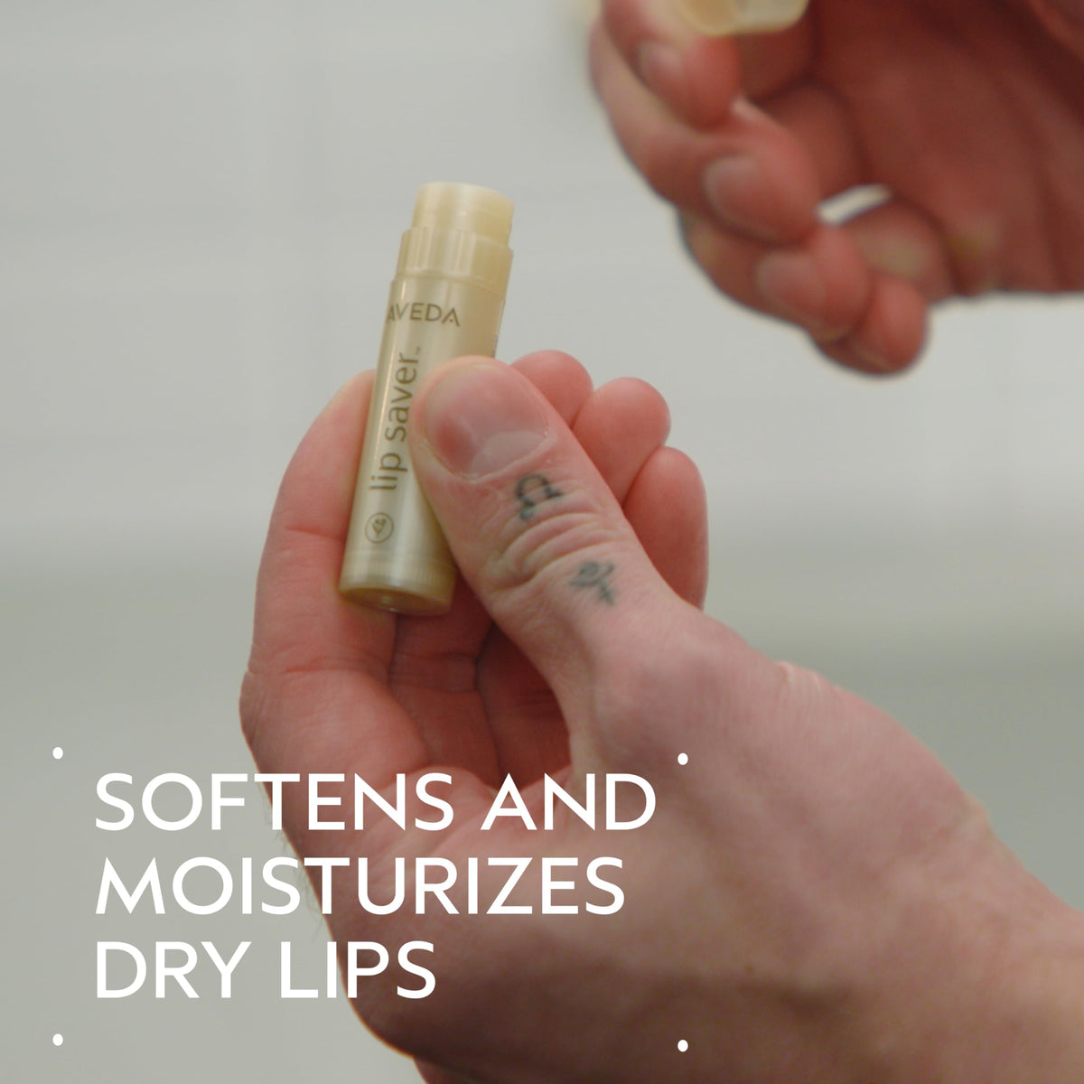 Aveda Lip Saver close-up texture on balm tip highlighting smooth moisturizing finish