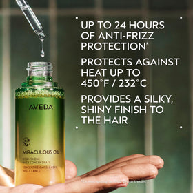 Aveda Miraculous Oil texture drop on fingertip demonstrating lightweight, non-greasy finish
