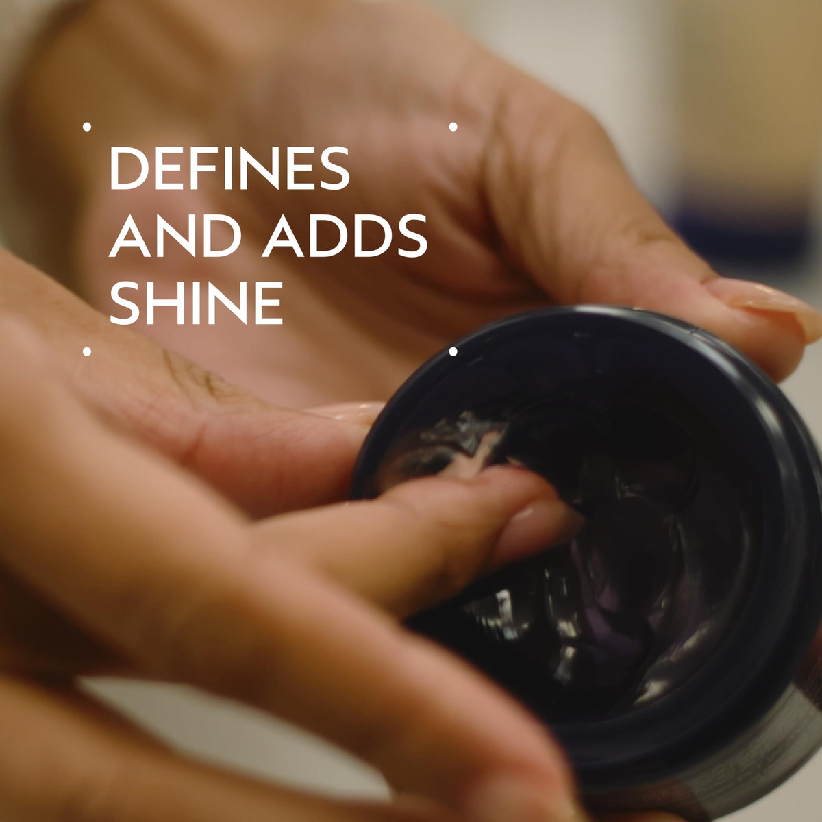 Aveda pomade texture close-up highlighting smooth humectant-rich formula