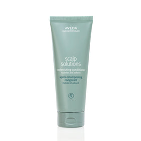 Aveda bottle front view showing packaging and product benefits