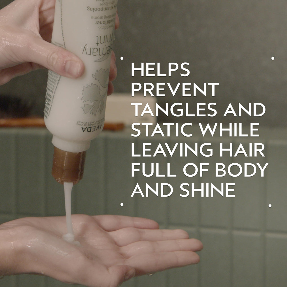 Aveda back label close-up displaying Rosemary Mint conditioner ingredients and usage information