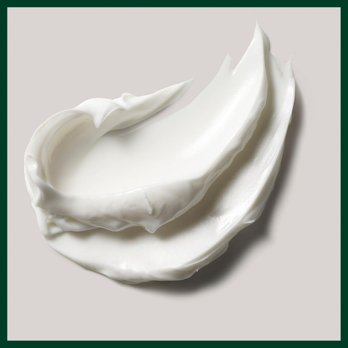 Close-up of sea algae and organic shea butter near Aveda product highlighting natural ingredients
