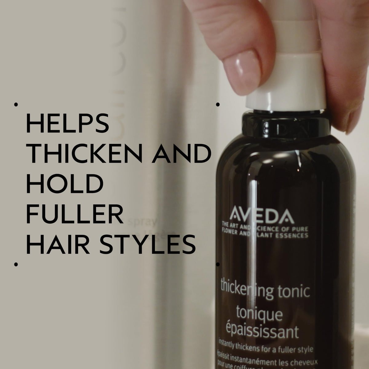 Aveda thickening tonic spray in hand demonstrating application and instant lift benefit