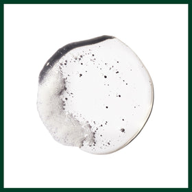 Aveda updo detail close view highlighting defined structure and glossy finish from the gel