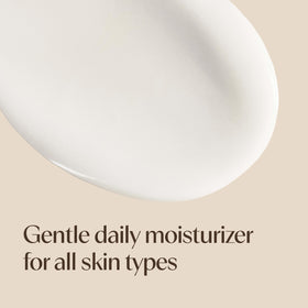 Aveeno 4 fl oz bottle beside everyday items for scale