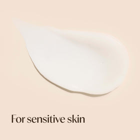 Aveeno applied on hand to show lightweight hydration and quick absorption