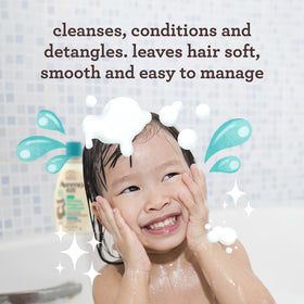 Aveeno Baby bottle close-up label highlighting oat extract and hypoallergenic callout