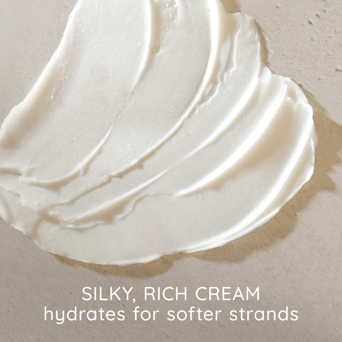 Aveeno creamy conditioner texture demonstrating smooth spreadability and moisture