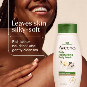 Aveeno bottle staged in shower to show daily use and soothing-skin benefit