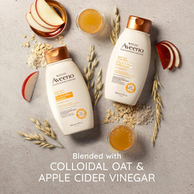 Aveeno bottles arranged with apple and oat visuals suggesting natural ingredients