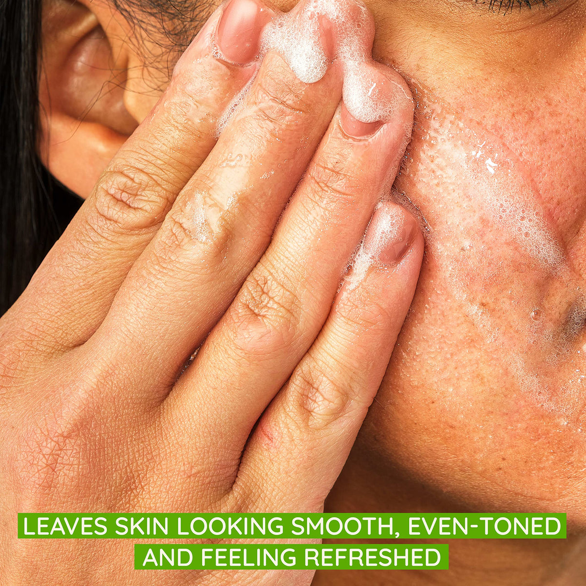 Aveeno close-up of natural exfoliating beads texture showing gentle polish for smoother skin