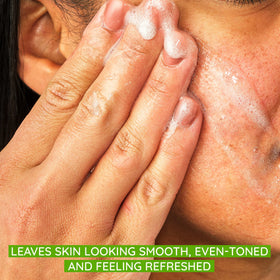 Aveeno close-up of natural exfoliating beads texture showing gentle polish for smoother skin