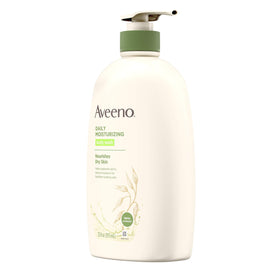Aveeno empty bottle beside recycling bin promoting sustainable disposal