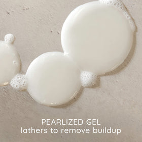 Aveeno oat milk shampoo in shower demonstrating gentle lather and soothing