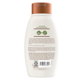 Aveeno oat milk shampoo texture poured to show creamy moisturizing feel