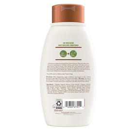 Aveeno product next to oats and almonds highlighting natural ingredients
