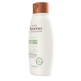 Hand holding 12 fl oz Aveeno bottle for size comparison and convenience