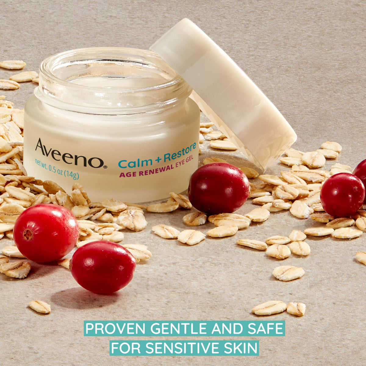 Aveeno 0.5 oz jar next to a fingertip, illustrates compact size and easy travel