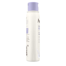Aveeno bottle in hand showing 12 fl oz size and portability