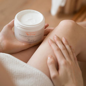 Avène jar on bathroom vanity suggesting a daily moisturizing routine